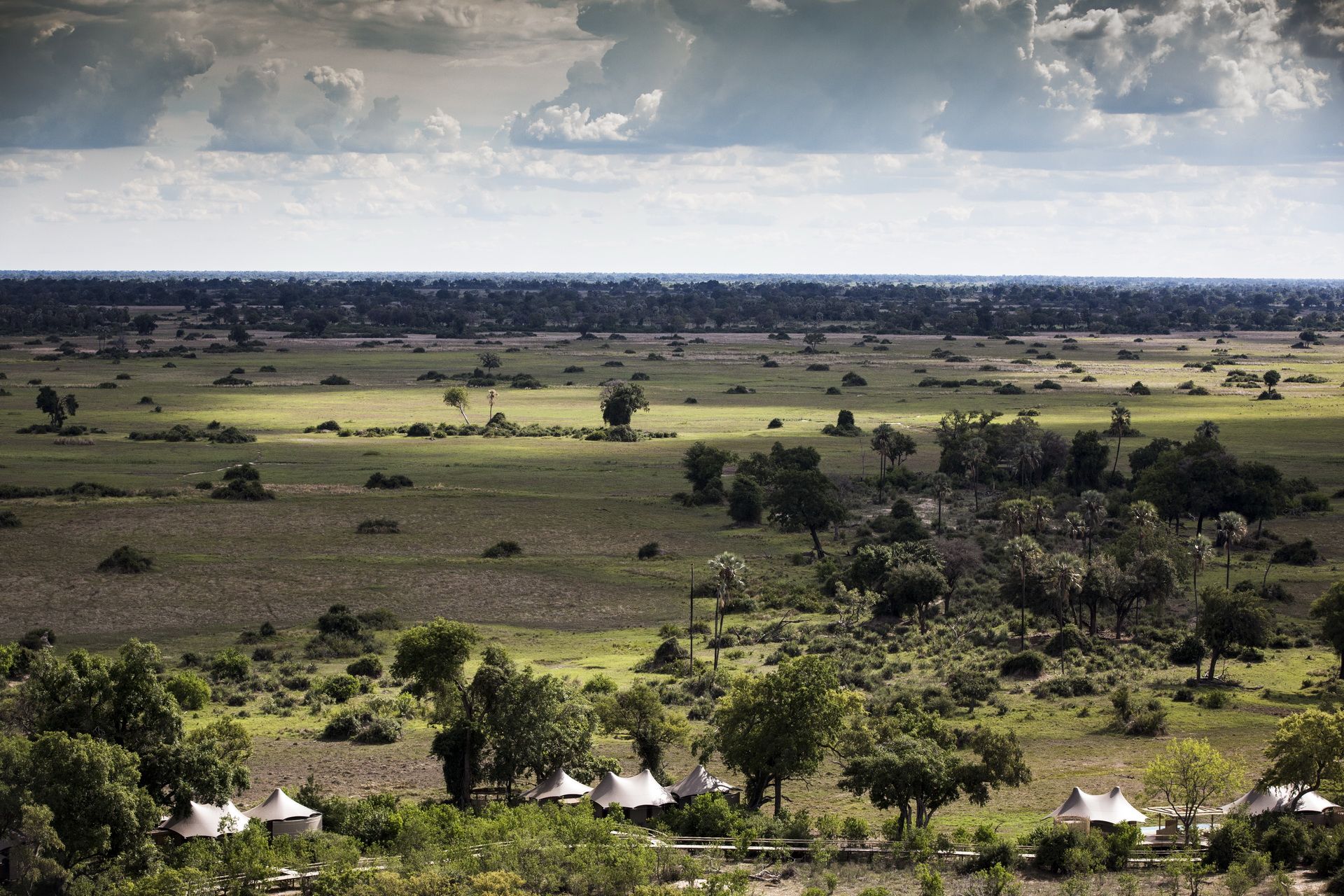 Aerials of Mombo tented villas that peel off on each side, Mombo Botswana